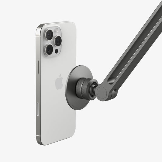 AMP09694 - Phone OneTap Clamp (MagFit) in Space Gray showing the back of the device hovering infront of the onetap clamp
