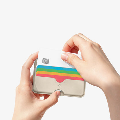 AFA07232 - MagSafe Card Holder Folder Pop (Mag Fit) in Rainbow showing a person holding the card holder while pulling out the card inside