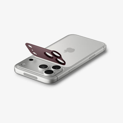 AGL12040 - iPhone 18 Pro Max Optik Pro XL EZ Fit Lens Protector in burgundy showing the lens protector aligned above the camera area before installation.