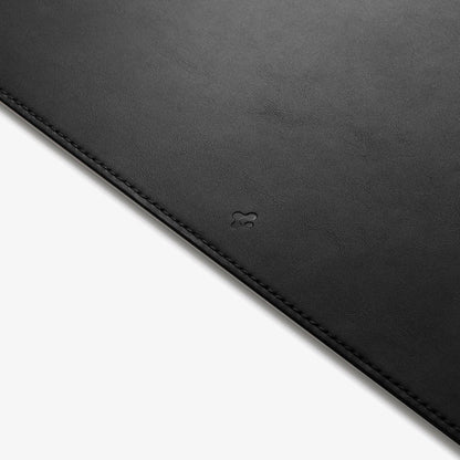 APP04762 - LD302 Desk Pad in black showing the front zoomed in on the Spigen logo