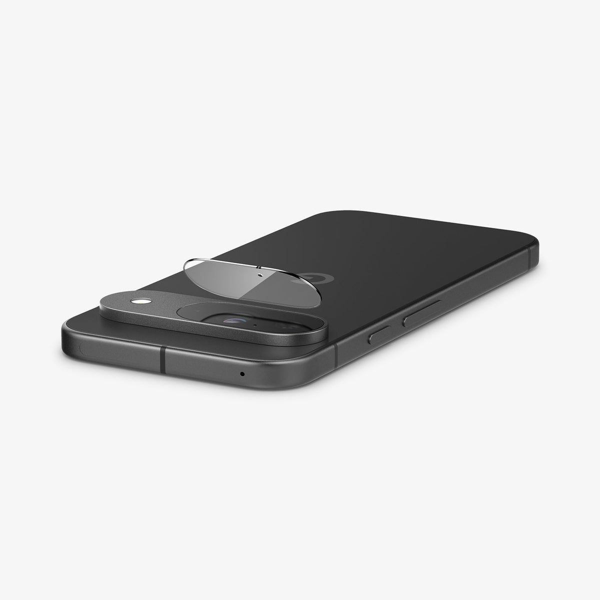 AGL08443 - Pixel 9 Case Optik EZ Fit Lens Protector in Crystal Clear showing the lens protector partially hovering in front of the camera lens