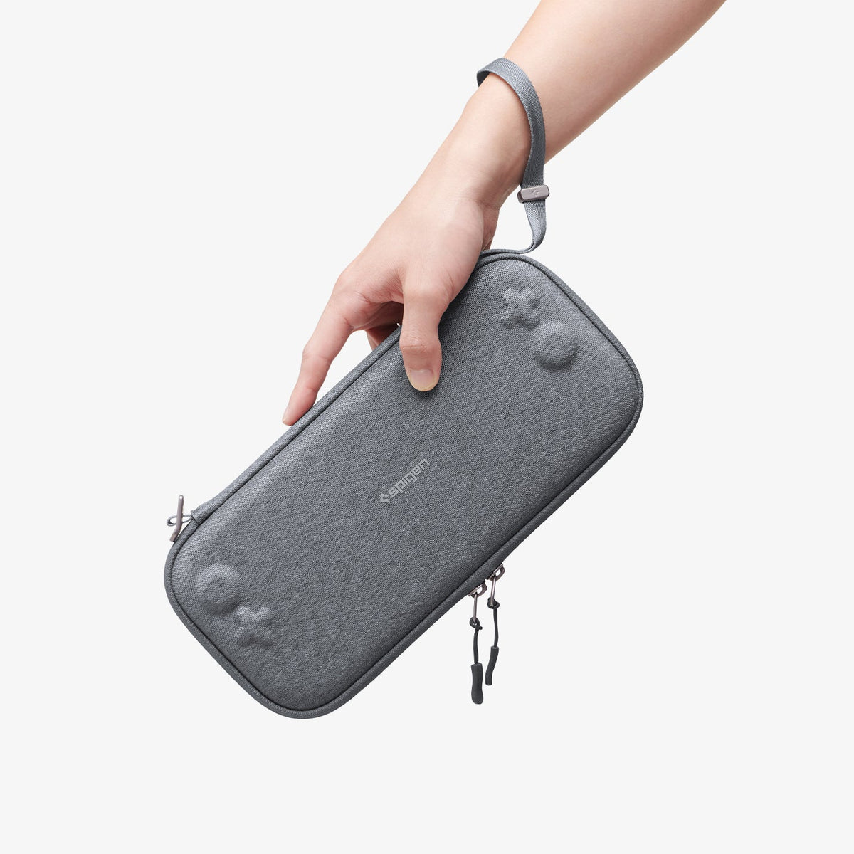 AGP10197 - Nintendo Switch 2 Klasden Pouch 2 in Charcoal Gray showing a person holding the pouch using the lanyard attached to their wrist.