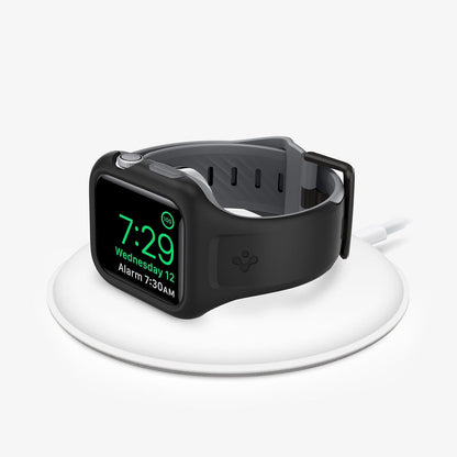 AMP02007 - Apple Watch Series (44mm) Case Liquid Air Pro in black showing the front with watch on wireless charger