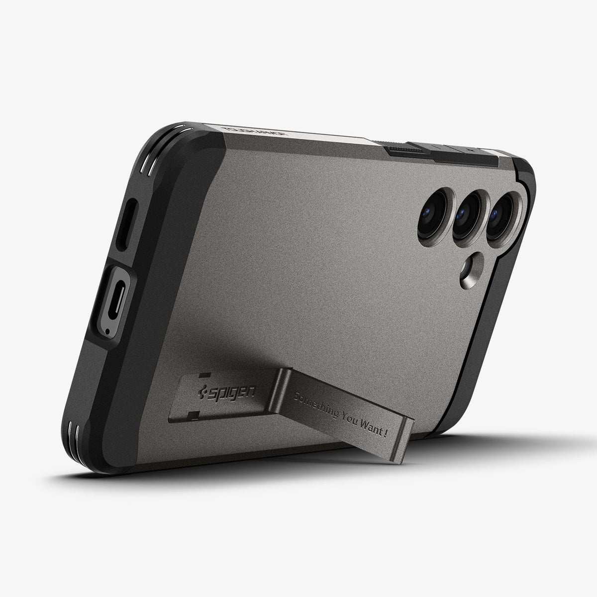 ACS07333 - Galaxy S24 Plus Case Tough Armor in Gunmetal showing the back, partial side and bottom with a built-in kickstand propped up