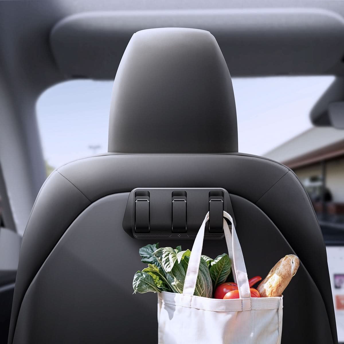 ACP09201 - Tesla Model 3 (2017-2023) Car Seat Hook TO283 in Black showing the front with grocery bag hanging on the hook
