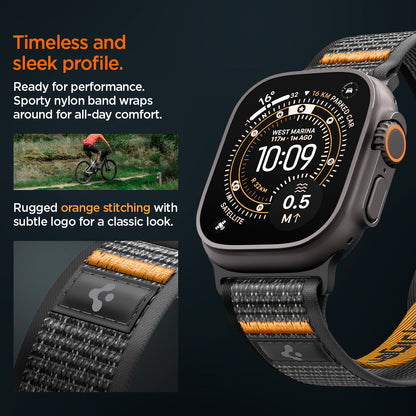 AMP10607 - Apple Watch Ultra Athlex Air 2 band lifestyle image showing rugged orange stitched nylon strap on Apple Watch Ultra with close-up of subtle logo patch highlighting timeless sleek profile sporty performance design and all-day comfort during outdoor cycling activity