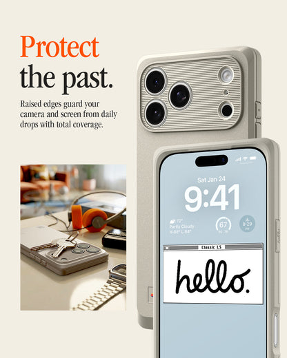 ACS10478 - iPhone 17 Pro Max Classic LS MagFit case showing the case's raised camera bezel and screen edge, with a lock screen reading "Classic LS hello." beside a desk scene.