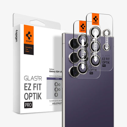 AGL07427 - Galaxy S24 Ultra Optik Pro EZ Fit Lens Protector in Violet showing the front of camera lens tray hovering in front of another camera lens tray and the device with the packaging